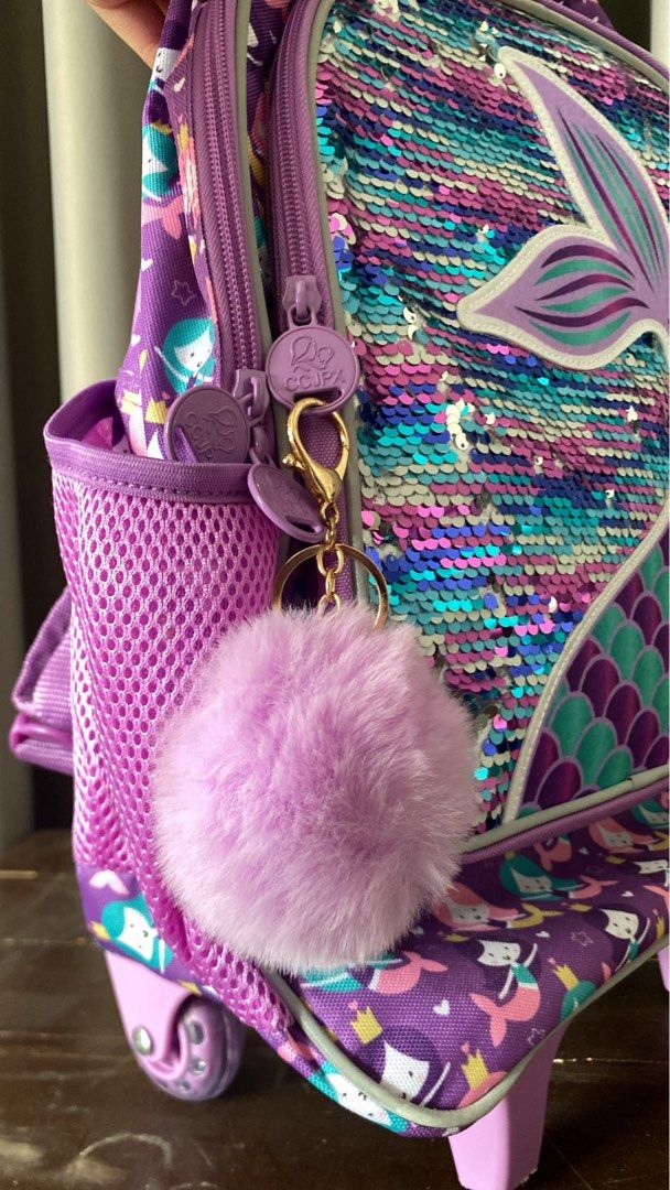 KIDS Purple Mermaid Sequin Stroller Backpack School bag (Category: Backpacks) located in Antipolo. Submitted by gaeumi (Listing ID 1441833115, Image 3). Description: ✦ never used ✦ with wheels, 2 water compartments, sequins, keychain, working zippers ✦ needs cleaning ✦ convertible to backpack ✦ has a small stain (please see photo) ✦ has 2 compartments - small (front) and big (with inner compartment).
