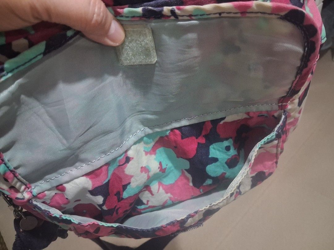 Kipling Crossbody Bag Floral Print with Monkey Charm (Category: Cross-body Bags) located in Angeles City. Submitted by anneps (Listing ID 1441897076, Image 2). Description: - Adorable Kipling crossbody bag with a charming floral print. - Features multiple pockets both inside and outside for excellent organization. - Adjustable strap ensures a comfortable fit for all-day wear. - Comes with the iconic Kipling monkey charm. - Ideal for everyday erra