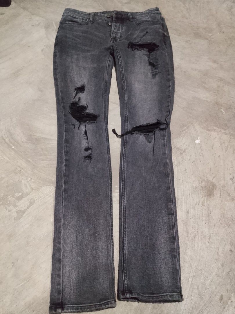 Ksubi Tsubi Distressed Jeans (Category: Jeans) located in Manila. Submitted by trumpisthedevil (Listing ID 1436269534, Image 3). Description: - Tsubi grey wash jeans - Distressed detailing - Unique back pocket patch: "ROYALTY HEROISM AND THE STREETS" - Slim fit - Button fly - Tsubi logo visible.