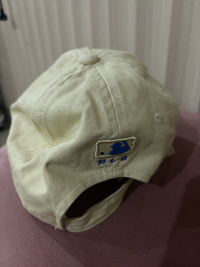 LA Dodgers MLB Baseball Cap (Category: Caps & Hats) located in Mandaluyong City. Submitted by getbounced (Listing ID 1441884110, Image 2). Description: - Cream colored cap - Blue LA logo - MLB logo on the side - Adjustable strap at the back - Perfect for casual wear or team support - Simple and classic design.