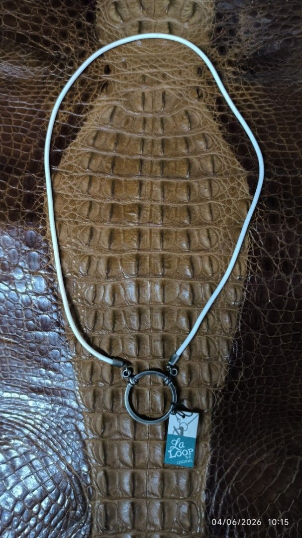 La Loop The Original Necklace Rubber white Antique silver Loop base metal (Category: Everything Else Others) located in Manila. Submitted by ddxdd (Listing ID 1441795658, Image 1). Description: - La Loop necklace - Features a circular pendant - White cord - Clasp with La Loop logo - Comes with original tag - Great accessory -Pede sabitan ng eyeglasses pag nasa leeg -Cord 24 inches, pendant loop 33cm diameter.