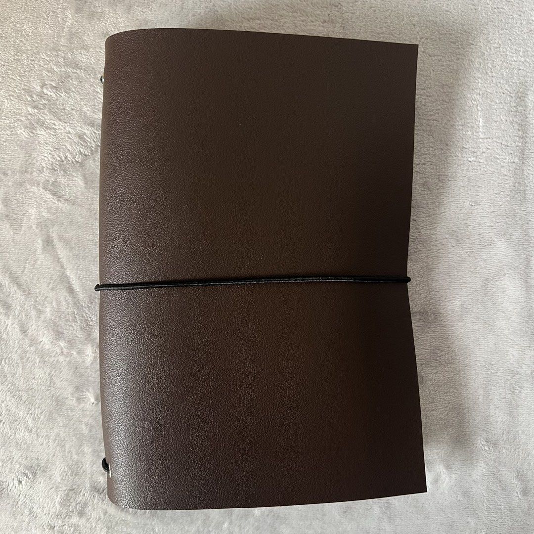 Leather Journal Folio (A5, Bifold) (Category: Stationery & School Supplies) located in Quezon City. Submitted by lucky.girlll (Listing ID 1441859200, Image 1). Description: - PU brown leather cover - Notebooks not included but uses standard size A5 notebooks.
