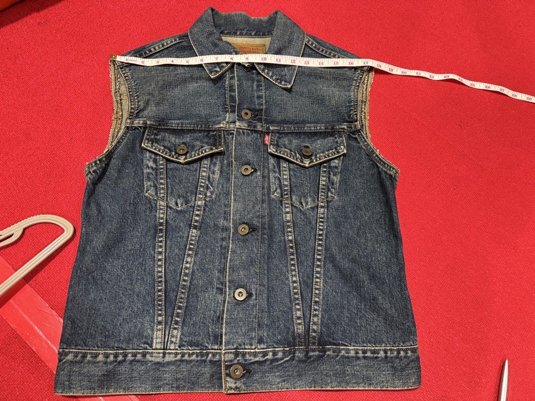 Levi's Blue Denim Sleeveless Vest Jacket (Category: Vests) located in Manila. Submitted by pormaatbpshoppe (Listing ID 1441839219, Image 1). Description: - Classic Levi's denim vest - Blue wash - Sleeveless design - Button-up front - Two chest pockets - Measurements: Pit to pit approx 17", Length approx 21" - Ideal for layering over t-shirts or hoodies - Versatile wardrobe staple.