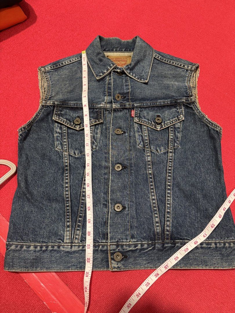 Levi's Blue Denim Sleeveless Vest Jacket (Category: Vests) located in Manila. Submitted by pormaatbpshoppe (Listing ID 1441839219, Image 2). Description: - Classic Levi's denim vest - Blue wash - Sleeveless design - Button-up front - Two chest pockets - Measurements: Pit to pit approx 17", Length approx 21" - Ideal for layering over t-shirts or hoodies - Versatile wardrobe staple.