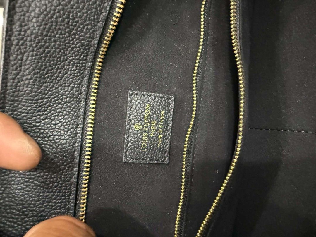 Louis Vuitton Black Leather Tote Bag (Category: Luxury Bags & Wallets) located in Bacolod City. Submitted by aprild. (Listing ID 1441820661, Image 3). Description: - Authentic Louis Vuitton black leather tote bag - Features elegant gold hardware - Secure zip closure - Multiple interior compartments for organization - Clean interior and exterior condition - Ideal for everyday use.