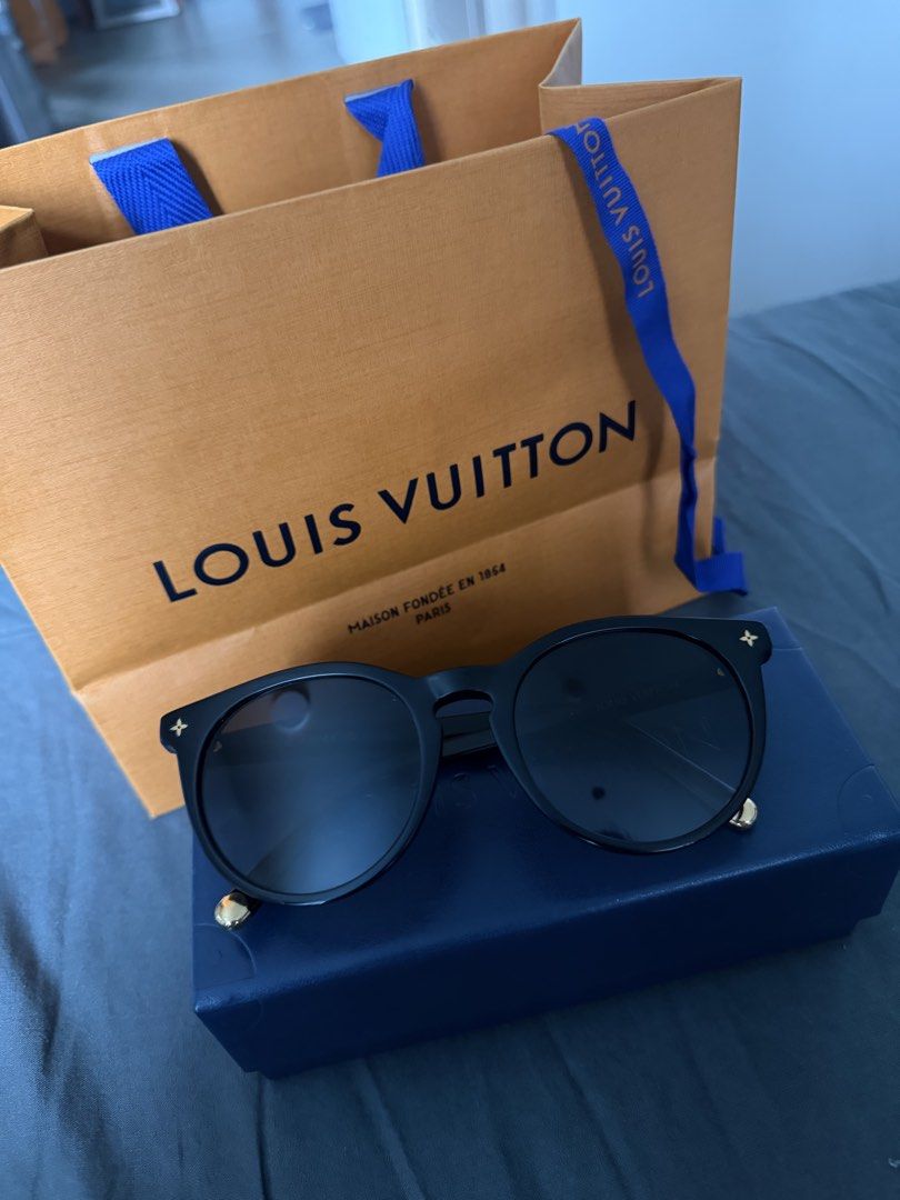Louis Vuitton Black Sunglasses with Monogram Details (Category: Sunglasses & Eyewear) located in Dasmarinas. Submitted by joy_declutteringacct (Listing ID 1441826063, Image 2). Description: - Authentic Louis Vuitton sunglasses - Classic round shape - Black acetate frames - Gold monogram details on arms and temples - Comes with original Louis Vuitton box and dust bag - Perfect for everyday or special occasions.