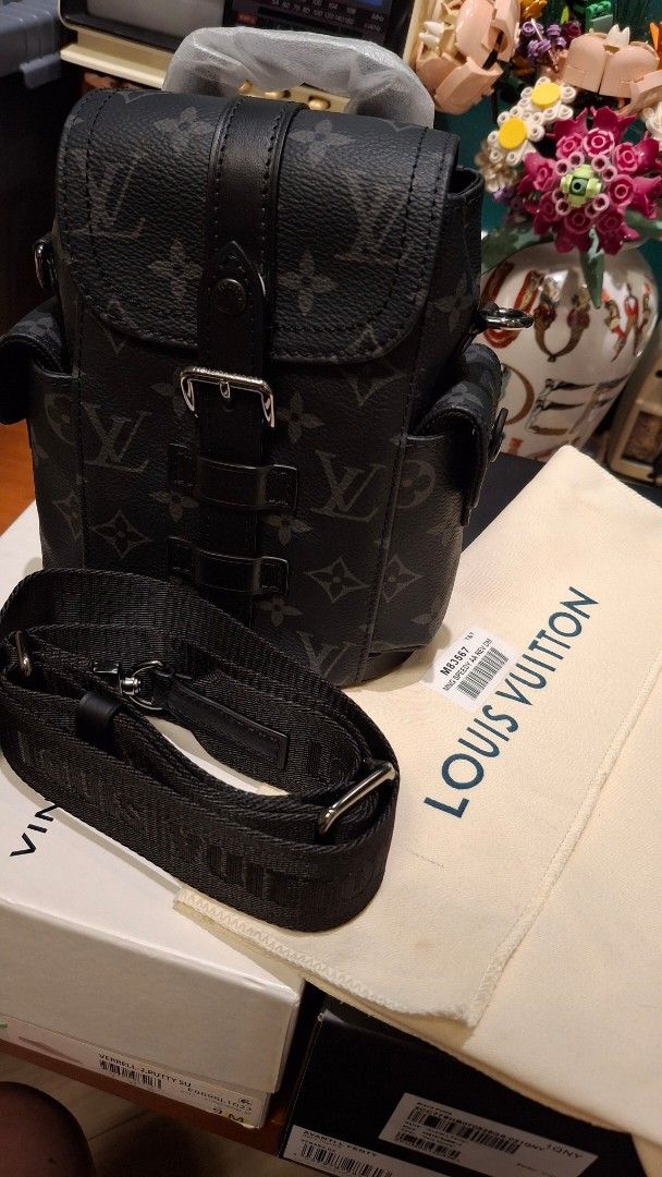Louis Vuitton Monogram Christopher Bag (Category: Luxury Bags & Wallets) located in Angono. Submitted by bagamania (Listing ID 1441788108, Image 1). Description: - Louis Vuitton Christopher XS Bag - Classic Monogram Pattern - Black and Grey Colorway - Buckle Closure - Adjustable Strap - Comes with Dust Bag - Ideal for carrying essentials - Unisex - NGA.