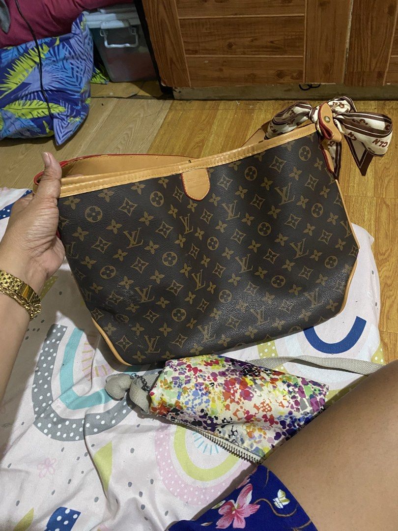 Louis Vuitton Monogram Shoulder Bag with Scarf (Category: Luxury Bags & Wallets) located in Navotas City. Submitted by corazonfar86465 (Listing ID 1441887634, Image 1). Description: - Authentic Louis Vuitton monogram shoulder bag - Comes with a charming silk scarf tied to the handle - Leather trim shows some signs of wear - Interior is clean and well-maintained - Ideal for everyday use - Selling because it's no longer used.