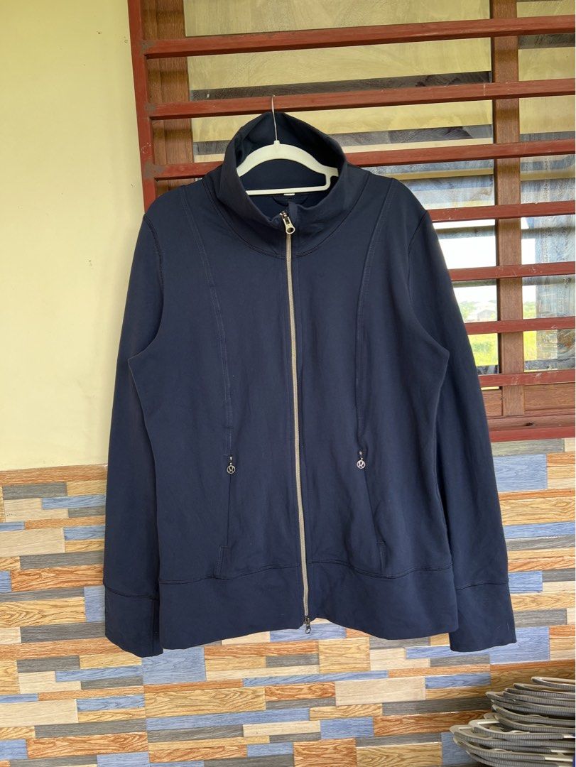 Lululemon Athletica Navy Blue Full Zip Jacket (Category: Coats, Jackets and Outerwear) located in Iba. Submitted by saploot (Listing ID 1441908128, Image 1). Description: - Navy blue Lululemon jacket - Full zip closure with a high collar - Front pockets with zipper pulls - Lululemon logo on back hem and one zipper pull - Ideal for workouts or casual wear.