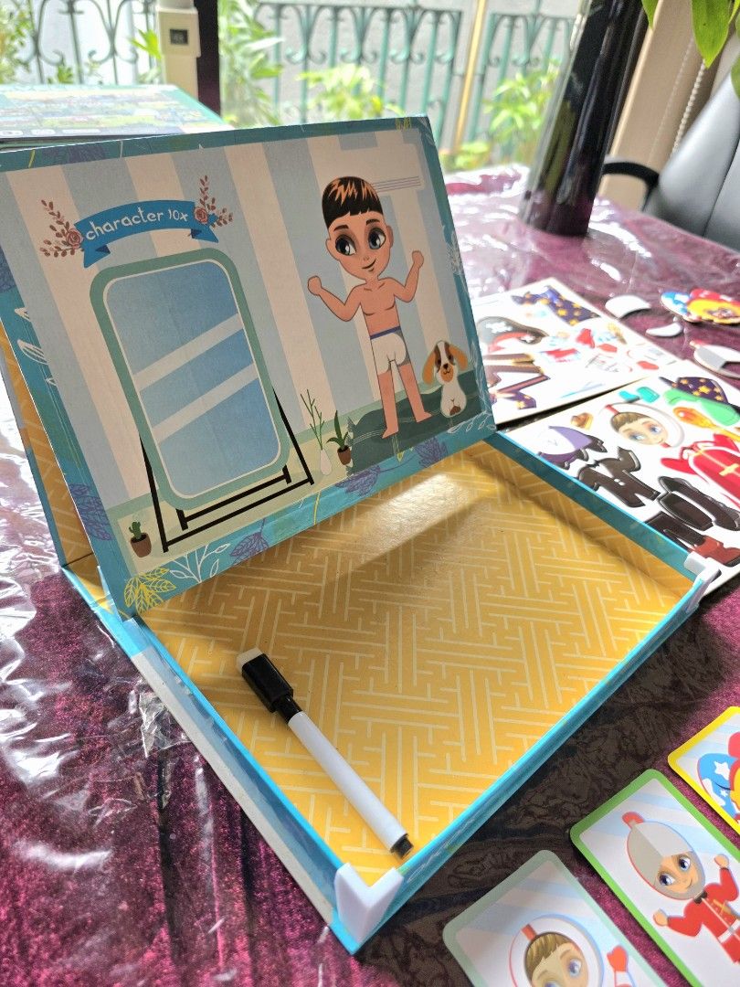 Magnetic Boy Dress Up Game (Category: Kids Toys) located in Manila. Submitted by jgponti (Listing ID 1441859154, Image 2). Description: - Magnetic dress-up game for boys - Includes boy figure and magnetic outfits - Comes with character cards - Box opens to a play scene - Includes a whiteboard marker - Recommended for ages 3 and up - Encourages imaginative play.