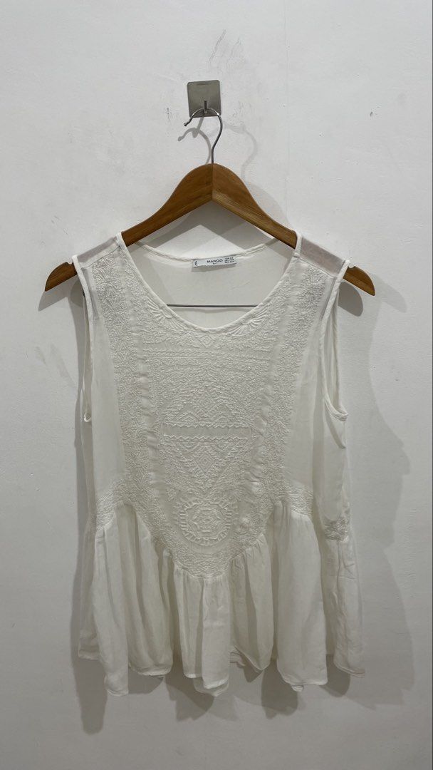 Mango White Embroidered Sleeveless Peplum Top (Category: Sleeveless) located in Las Pinas. Submitted by qcleopatrastrove (Listing ID 1441916376, Image 1). Description: *Small tears at front and back near the arm hole (See photo nos. 5 and 6) Please manage your expectations. Thank you.🤎.