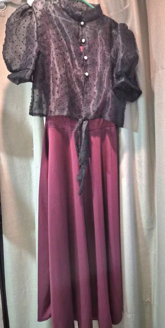 Maroon Maxi Dress with Black Sheer Overlay Top (Category: Dresses) located in Las Pinas. Submitted by prettychat (Listing ID 1441908881, Image 3). Description: - Two-piece outfit: Maroon maxi dress with flowing skirt and fitted bodice. - Black lacey Filipiana top with puff sleeves and pearl button details. - Adjustable tie at the waist for a custom fit. - Ideal for parties, events, or any special occasion. - Comfortable and stylish design..