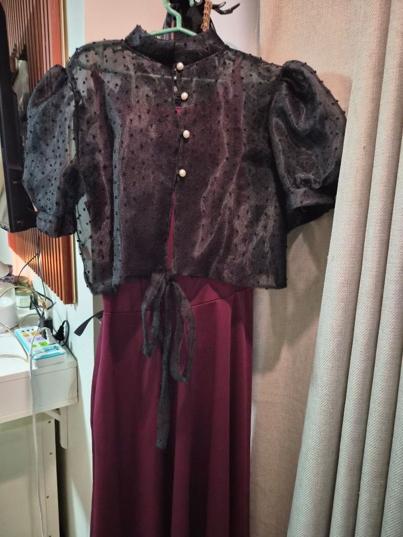 Maroon Maxi Dress with Black Sheer Overlay Top (Category: Dresses) located in Las Pinas. Submitted by prettychat (Listing ID 1441908881, Image 1). Description: - Two-piece outfit: Maroon maxi dress with flowing skirt and fitted bodice. - Black lacey Filipiana top with puff sleeves and pearl button details. - Adjustable tie at the waist for a custom fit. - Ideal for parties, events, or any special occasion. - Comfortable and stylish design..