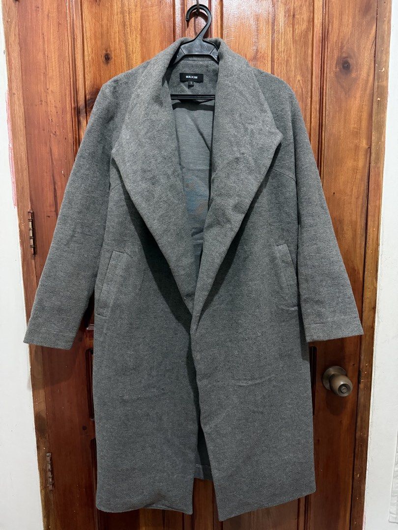 MAXIM Grey Long Coat Size S (Category: Coats, Jackets and Outerwear) located in Taguig. Submitted by outfitlab_ (Listing ID 1441953869, Image 1). Description: - MAXIM Grey Long Coat - Size: S - Features side pockets - Simple and classic design - Ideal for layering - Great for cooler weather.