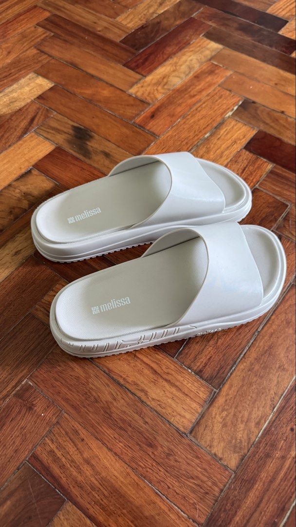 Melissa Slides Beige Size US 7 EU 38 (Category: Slippers and slides) located in Makati City. Submitted by preloved_biancak (Listing ID 1441792933, Image 1). Description: Only tried on once, good as new SRP 3,295 Selling for 1,500 - Brand: Melissa - Color: Light Beige - Size: US 7, EU 38 - Origin: Made in Brazil - Features: Super comfy, easy slip-on, unique sole tread pattern - Ideal for: Casual wear, poolside.