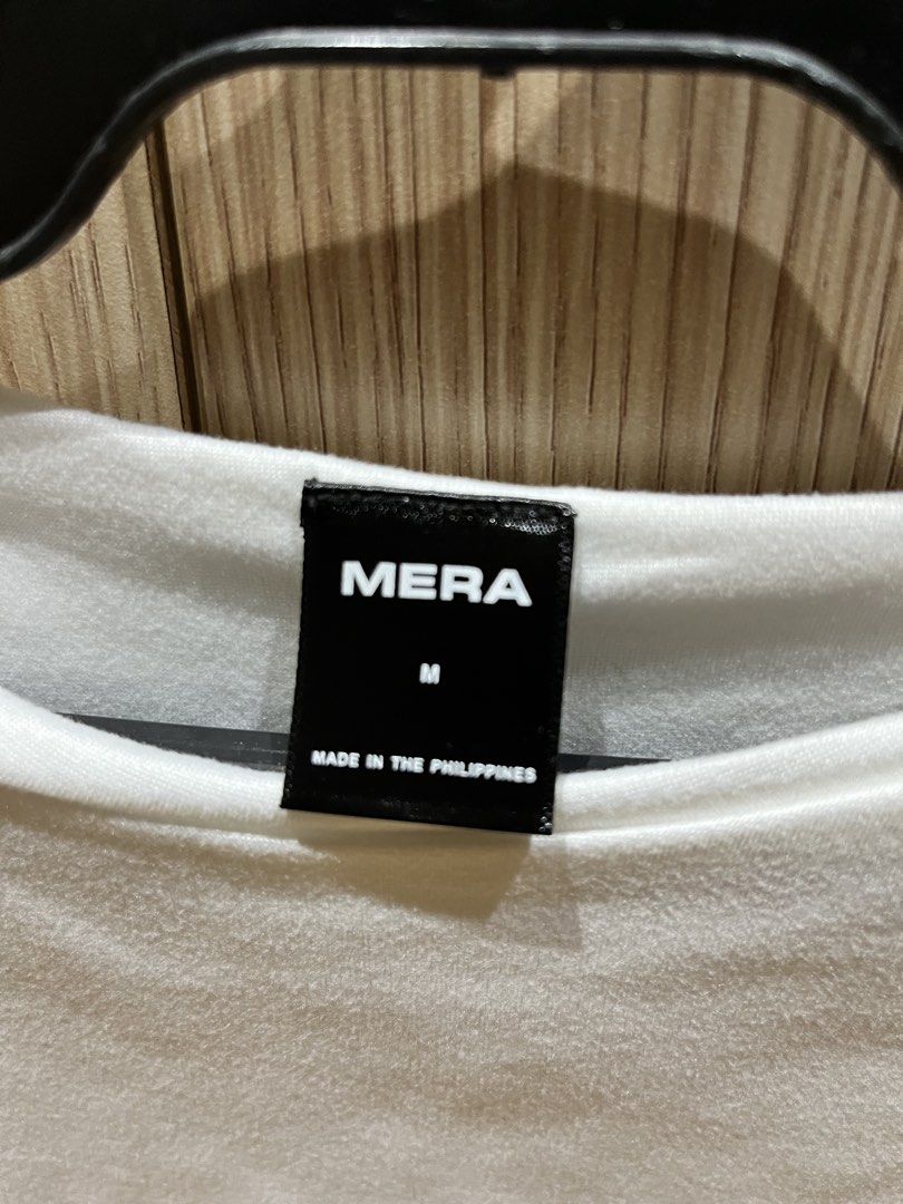 Mera Basic White Shirt (Category: Shirts) located in Mandaluyong City. Submitted by hyyzl (Listing ID 1441946519, Image 2). Description: Brand: MERA - 9/10 condition, worn once - white in color - cotton fabric & very comfy (double-lined) - slightly stretchable - bought from Tiktok shop - can fit S-M RFS: Decluttering Message for other price offers/questions..
