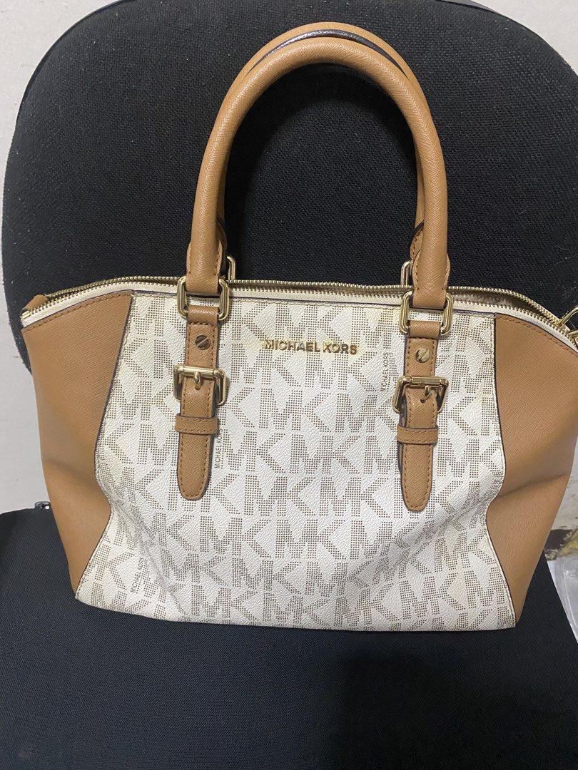 Michael Kors Signature Monogram Tote Bag (Category: Luxury Bags & Wallets) located in Las Pinas. Submitted by ecarg2072 (Listing ID 1441858010, Image 3). Description: - Authentic Michael Kors tote bag - Signature MK print all over - Tan leather trim and handles - Gold hardware details - Zipper closure for security - Includes a detachable shoulder strap - Spacious interior for all your essentials.