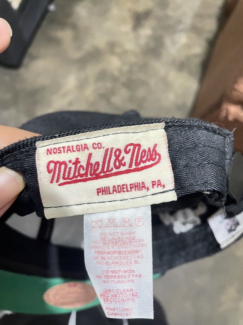 Mitchell & Ness NFL Raiders Vintage Collection Cap (Category: Caps & Hats) located in Manila. Submitted by cosmicearth_67b6b9 (Listing ID 1441935090, Image 3). Description: - Mitchell & Ness NFL Raiders Cap - Vintage Collection - Color: Black with White Raiders Logo - Green Underbrim - Made in Bangladesh (check tags for details) - Ideal for any Raiders fan.
