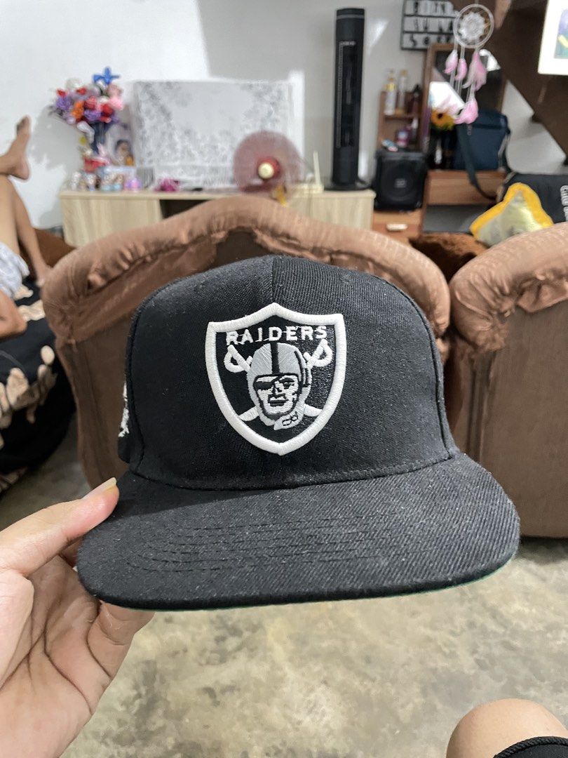 Mitchell & Ness NFL Raiders Vintage Collection Cap (Category: Caps & Hats) located in Manila. Submitted by cosmicearth_67b6b9 (Listing ID 1441935090, Image 1). Description: - Mitchell & Ness NFL Raiders Cap - Vintage Collection - Color: Black with White Raiders Logo - Green Underbrim - Made in Bangladesh (check tags for details) - Ideal for any Raiders fan.