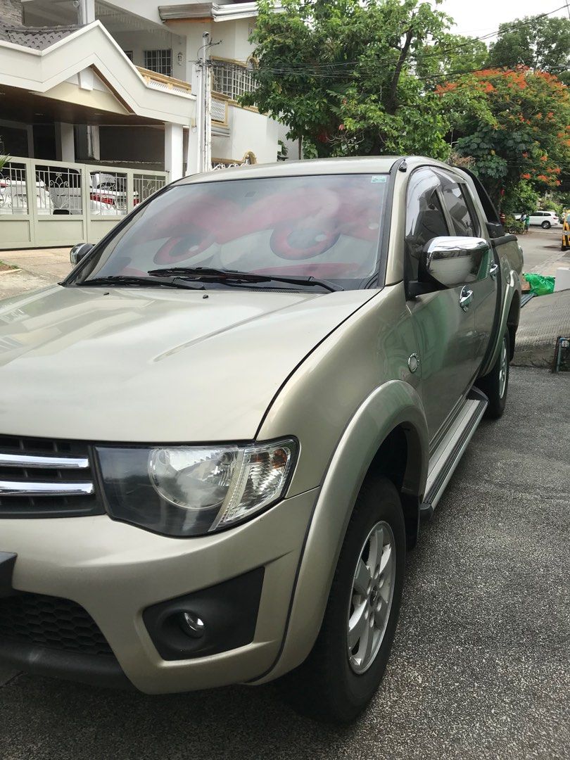 Mitsubishi Strada GLX Manual (Category: Used Cars) located in Quezon City. Submitted by jbalt (Listing ID 1441839009, Image 3). Description: 2010 Mitsubishi Pickup Strada GLX 4X2 Manual Transmission. 1st owner and updated car registration. 90km Mileage. Makinis Beige Color with 10-inch android head unit (Netflix, YouTube, Sportify, etc.), android auto/apple carplay and JBL subwoofer, Carryboy automatic roller lid, bedliner, Carryboy roll bar, rev