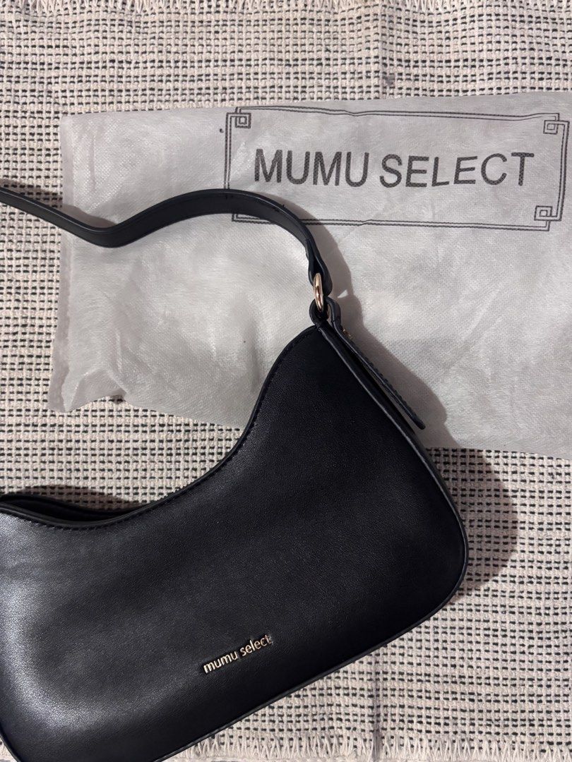 Mumu Select Black Shoulder Bag (Category: Shoulder Bags) located in Pasay City. Submitted by alt.collectives (Listing ID 1441867674, Image 1). Description: Once used - Closure: Zipper - Interior: Zip pocket - Includes: Dust bag - Design: Simple and classic.