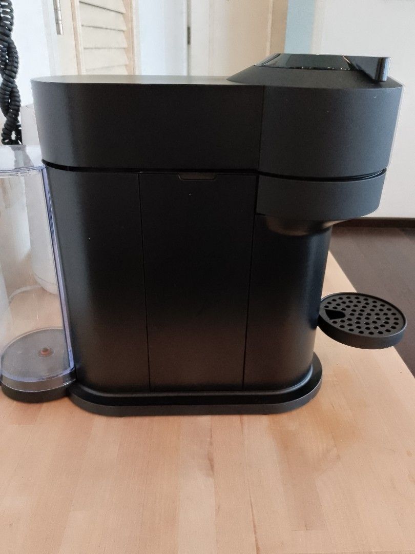 Nespresso Vertuo Coffee Machine (Category: Coffee Machines & Makers) located in Manila. Submitted by tarah.malditah (Listing ID 1441861555, Image 2). Description: - Black Nespresso Vertuo coffee machine - Works well, perfect for your daily coffee fix - Easy to use - Comes with water tank - Minor coffee grounds around the base (selling as is).