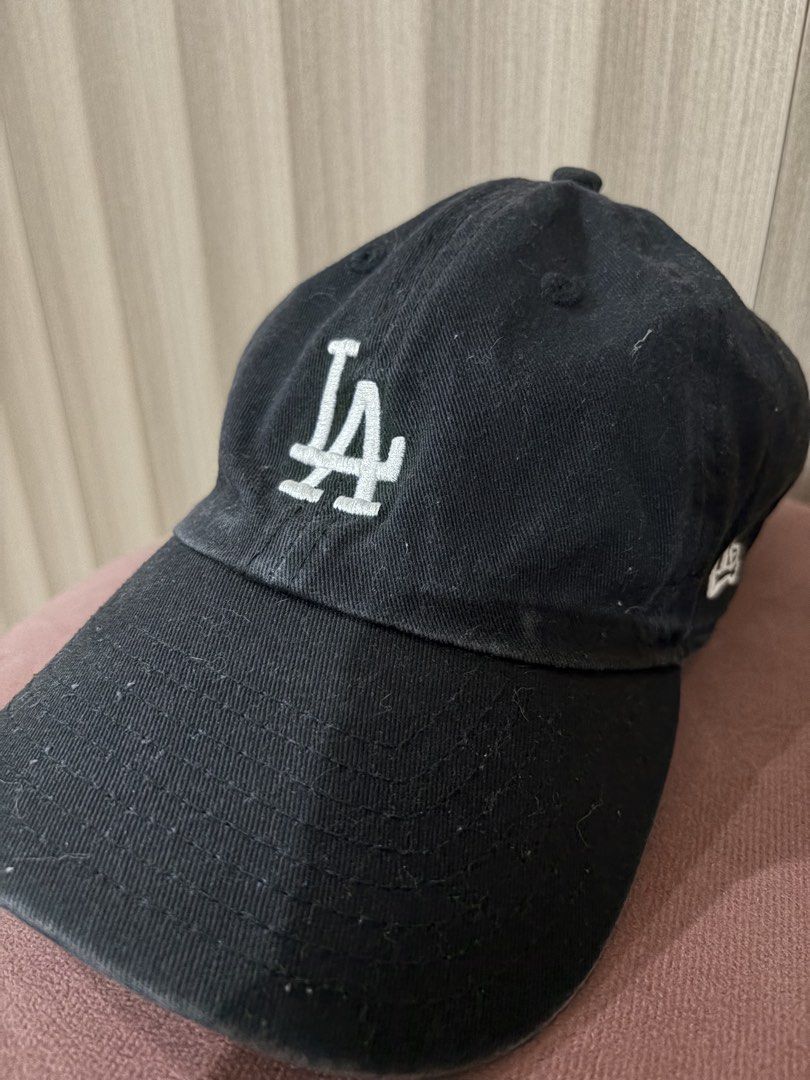 New Era LA Dodgers Black Baseball Cap (Category: Caps & Hats) located in Mandaluyong City. Submitted by getbounced (Listing ID 1441881147, Image 1). Description: - Black LA Dodgers cap - Iconic LA logo on front - New Era logo on side - Adjustable strap for a comfortable fit - Made from 100% cotton - Perfect for everyday wear or showing team spirit.