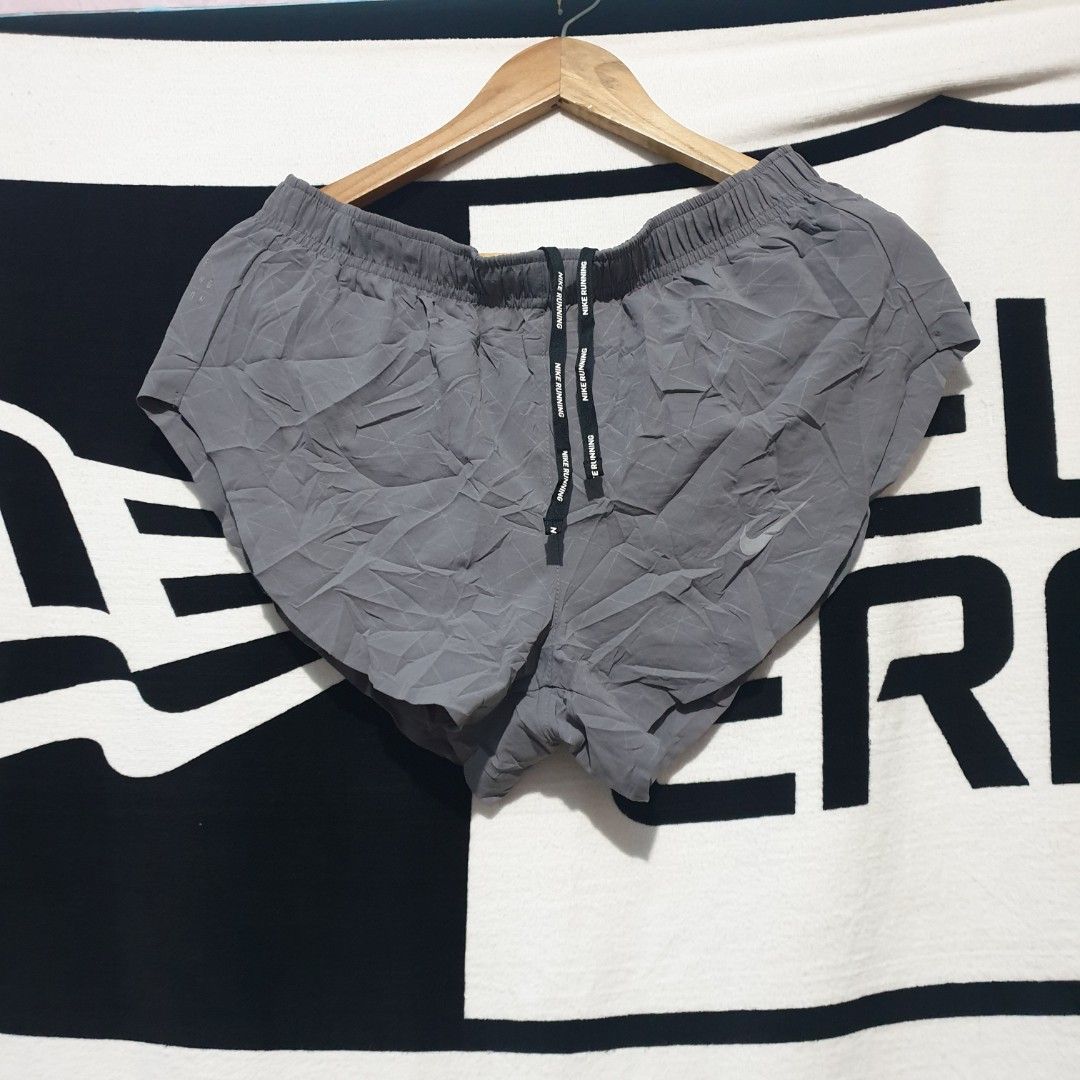 Nike Running Division Grey Split Shorts (Category: Shorts) located in Barotac Nuevo. Submitted by ehsherjohn27 (Listing ID 1441927407, Image 1). Description: - Grey Nike running shorts - Features Nike Running Division logo - Lightweight and breathable fabric - Split sides for enhanced freedom of movement - Elastic waistband with adjustable drawstring - Perfect for running and workouts.