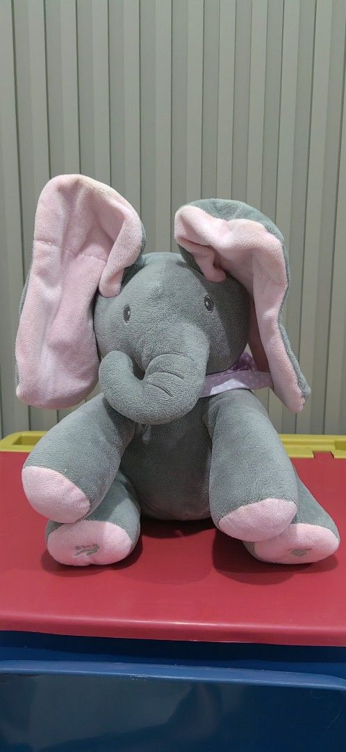 Peek-a-Boo Elephant Plush Toy (Category: Plushies & Soft Toys) located in Tagaytay City. Submitted by mrskai (Listing ID 1441901997, Image 1). Description: - Adorable peek-a-boo elephant plush toy. - Interactive feature: Ears move when foot is pressed. - Soft and cuddly grey elephant with charming pink accents. - Ideal gift for children. - Suitable for both playtime and bedtime. Good Condition. Sounds Working. Just need to replace Battery. Reason