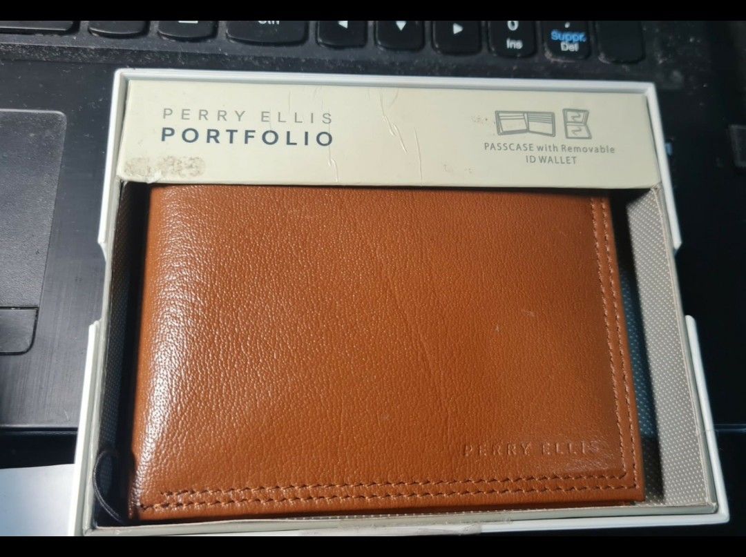 Perry Ellis Portfolio Brown Leather Wallet (Category: Wallets & Card Holders) located in Angeles City. Submitted by ejhere (Listing ID 1441966120, Image 1). Description: - Brand: Perry Ellis Portfolio - Material: Brown Leather - Style: Bifold Wallet - Features: Removable ID wallet - Condition: Great, like new - Includes: Original box - Design: Classic and simple.