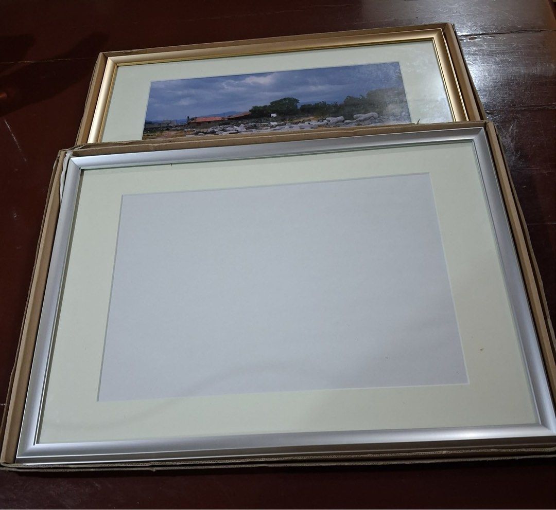 Picture Frames (Category: Frames & Pictures) located in Pasig City. Submitted by stelala19 (Listing ID 1441921097, Image 1). Description: New frames constructed from silver-toned or gold-toned aluminum, with acrylic glass and backing board. Perfect in displaying photos, watercolors or drawings, and paintings. Frame size is L13.5in x W18.5in. Can accommodate photos or paintings size W12.5in x L9in. Shipping c/o buyer MOP: GCash BPI BDO Location: P
