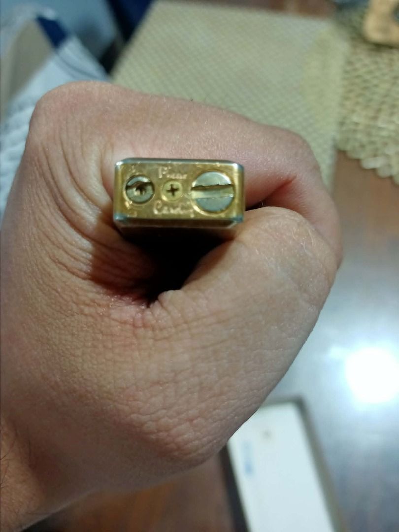 Pierre Cardin Lighter - Vintage Gold (Category: Luxury Accessories) located in Mandaluyong City. Submitted by adriandelacruz3840 (Listing ID 1441829649, Image 2). Description: Vintage Pierre Cardin Slim Gold-Tone Gas Lighter For sale: An authentic, vintage Pierre Cardin pocket gas lighter featuring a sleek, ultra-slim silhouette. It has an elegant brushed gold-tone finish with the classic cursive Pierre Cardin signature beautifully engraved at th