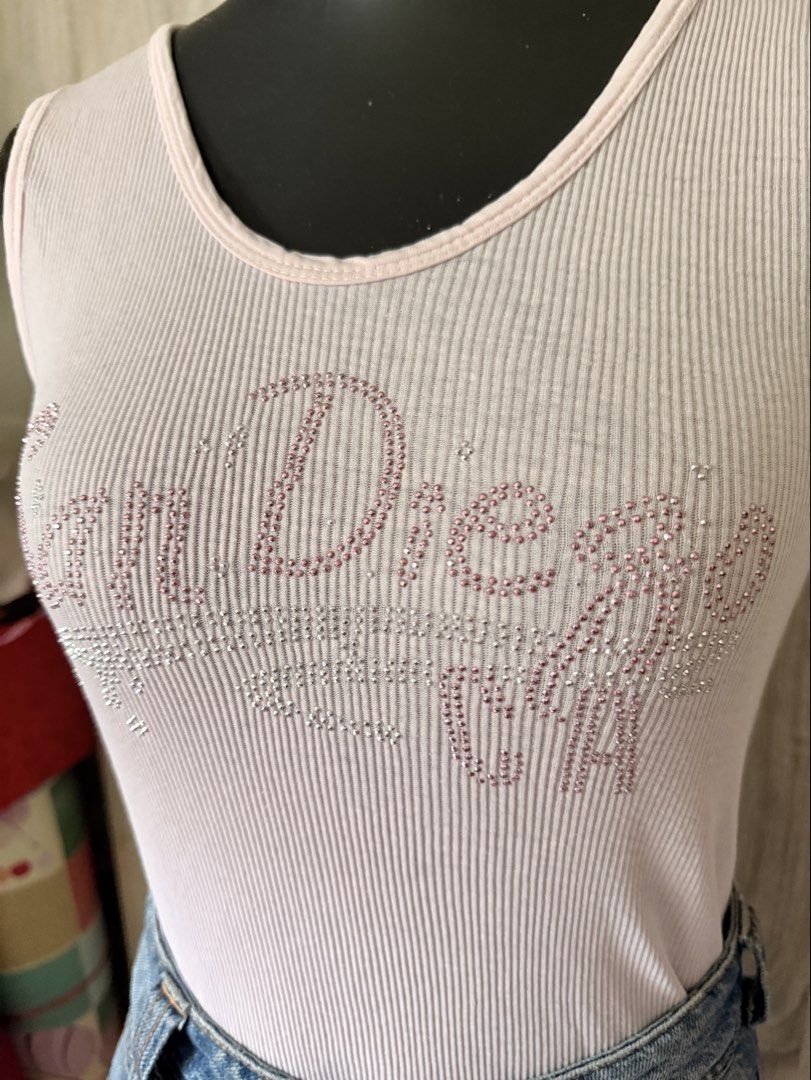 Pink Tank Top (Category: Sleeveless) located in Caloocan City. Submitted by prettyplease000 (Listing ID 1441841097, Image 2). Description: - Cute pink ribbed tank top - "San Diego" text in sparkly rhinestones - Sleeveless design - Scoop neckline - Versatile for casual wear or nights out - Easy to pair with jeans or shorts almost vintage.