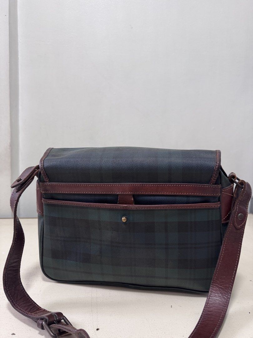 Polo Ralph Lauren Plaid Messenger Bag (Category: Luxury Bags & Wallets) located in Marikina City. Submitted by classicloset (Listing ID 1441839722, Image 2). Description: - Classic Polo Ralph Lauren messenger bag - Iconic plaid pattern - Leather trim and buckle closures - Zippered main compartment - Adjustable strap for comfortable wear - Great for everyday use or travel - A timeless piece.