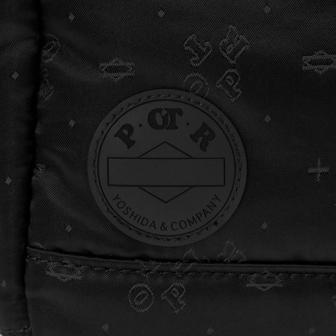 PORTER / MONOGRAM 2WAY TOTE BAG (L) Black (Category: Luxury Bags & Wallets) located in Manila. Submitted by junstar15 (Listing ID 1441908077, Image 2). Description: - PORTER Monogram 2-way tote bag - Size: Large (L) - Color: Black with subtle all-over monogram pattern - Interior: Bright teal with multiple pockets - Exterior: Zippered pocket - Carrying options: Handheld or shoulder strap - Ideal for: Everyday use.