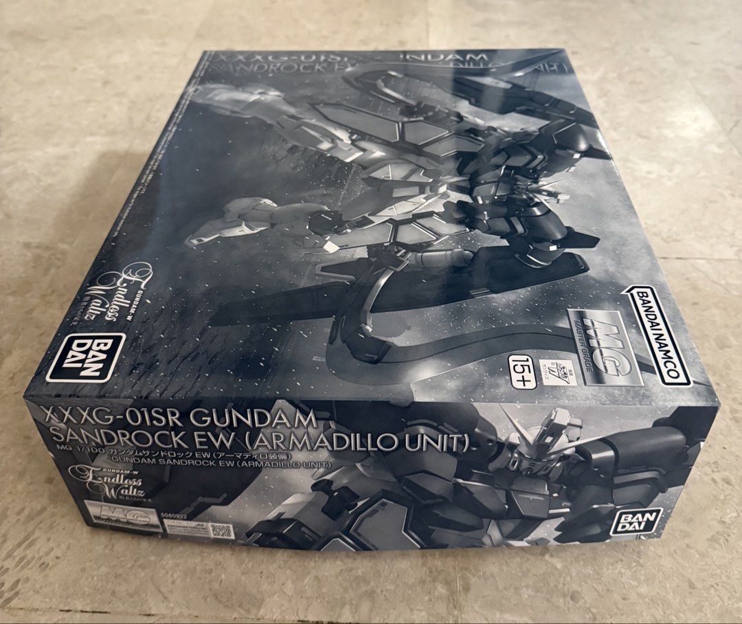Premium Bandai gunpla MG 1/100 GUNDAM SANDROCK EW (ARMADILLO UNIT) (Category: Gundam Model Kits) located in Singapore. Submitted by lordsatan666 (Listing ID 1441877757, Image 2). Description: Premium Bandai gunpla MG 1/100 GUNDAM SANDROCK EW (ARMADILLO UNIT) Brand new in box, all runners are sealed, box in prefect condition too..