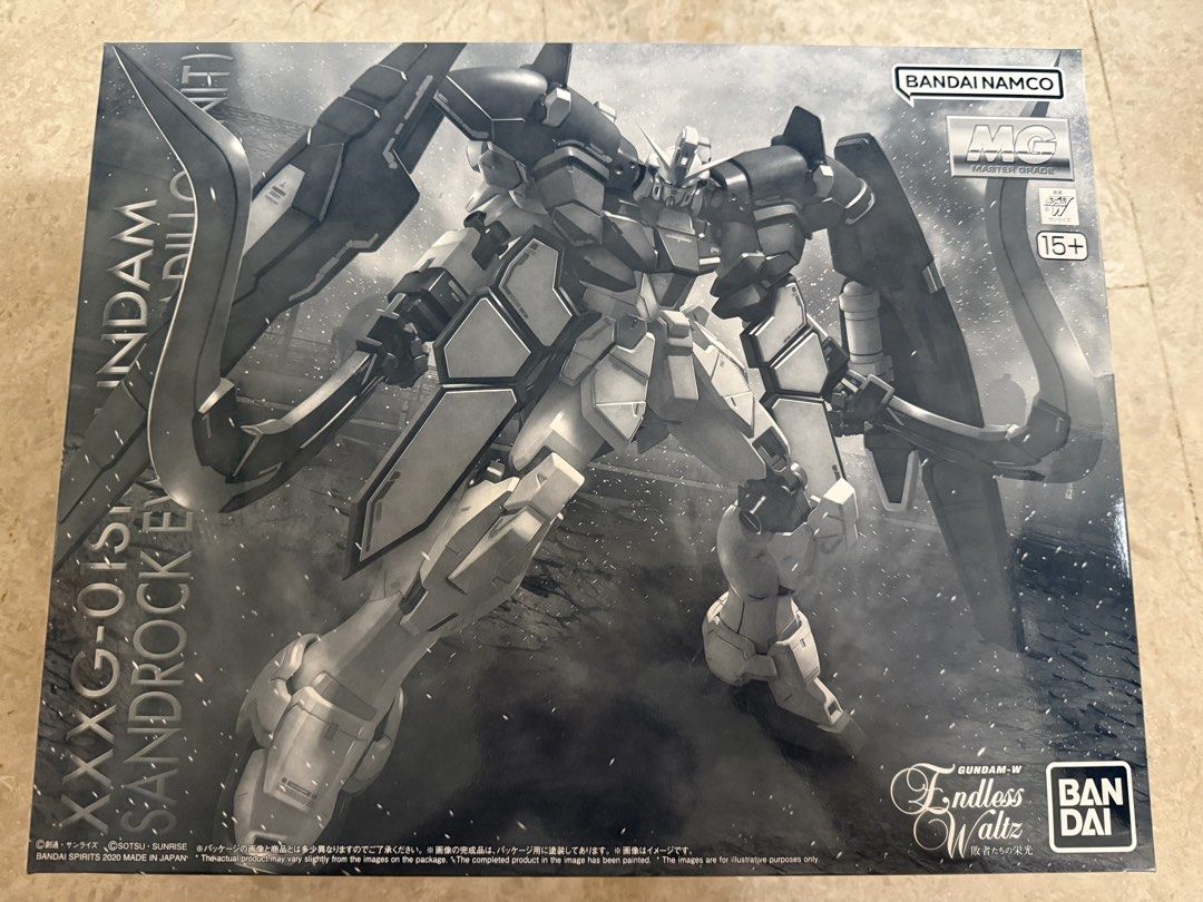Premium Bandai gunpla MG 1/100 GUNDAM SANDROCK EW (ARMADILLO UNIT) (Category: Gundam Model Kits) located in Singapore. Submitted by lordsatan666 (Listing ID 1441877757, Image 1). Description: Premium Bandai gunpla MG 1/100 GUNDAM SANDROCK EW (ARMADILLO UNIT) Brand new in box, all runners are sealed, box in prefect condition too..