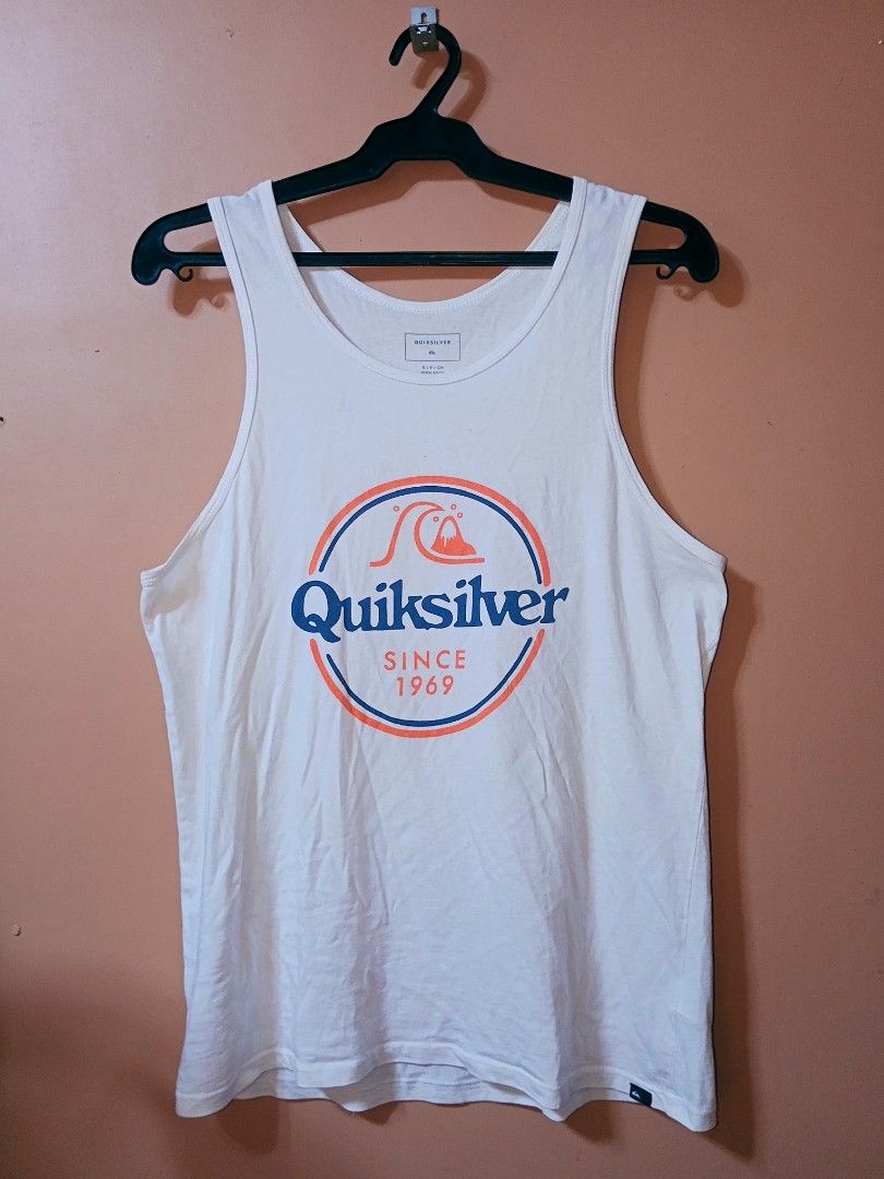 Quiksilver White Tank Top Since 1969 (Category: Sleeveless) located in Victorias. Submitted by nekken620 (Listing ID 1441944671, Image 1). Description: - White Quiksilver tank top - Features classic Quiksilver logo with 'Since 1969' text - Ideal for casual wear or beach days - Made with comfortable and breathable material - A summer wardrobe essential.