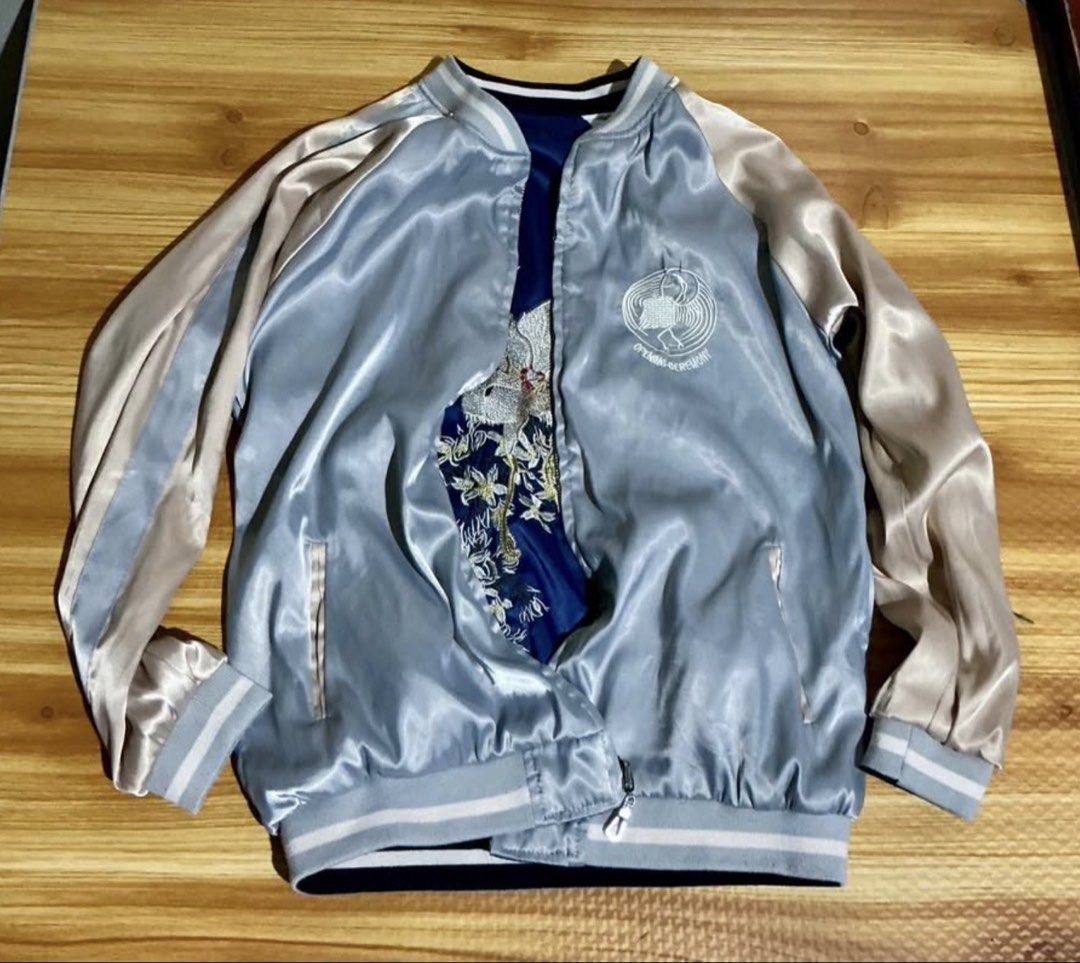 Reversible Embroidered Bomber Jacket (Category: Coats, Jackets and Outerwear) located in Manila. Submitted by irthrift (Listing ID 1441970212, Image 3). Description: - Cool reversible bomber jacket - Vibrant blue side with intricate bird and floral embroidery - Sleek light blue and beige satin side - Features ribbed cuffs and hem - Perfect for creating a statement look - Ideal for layering.