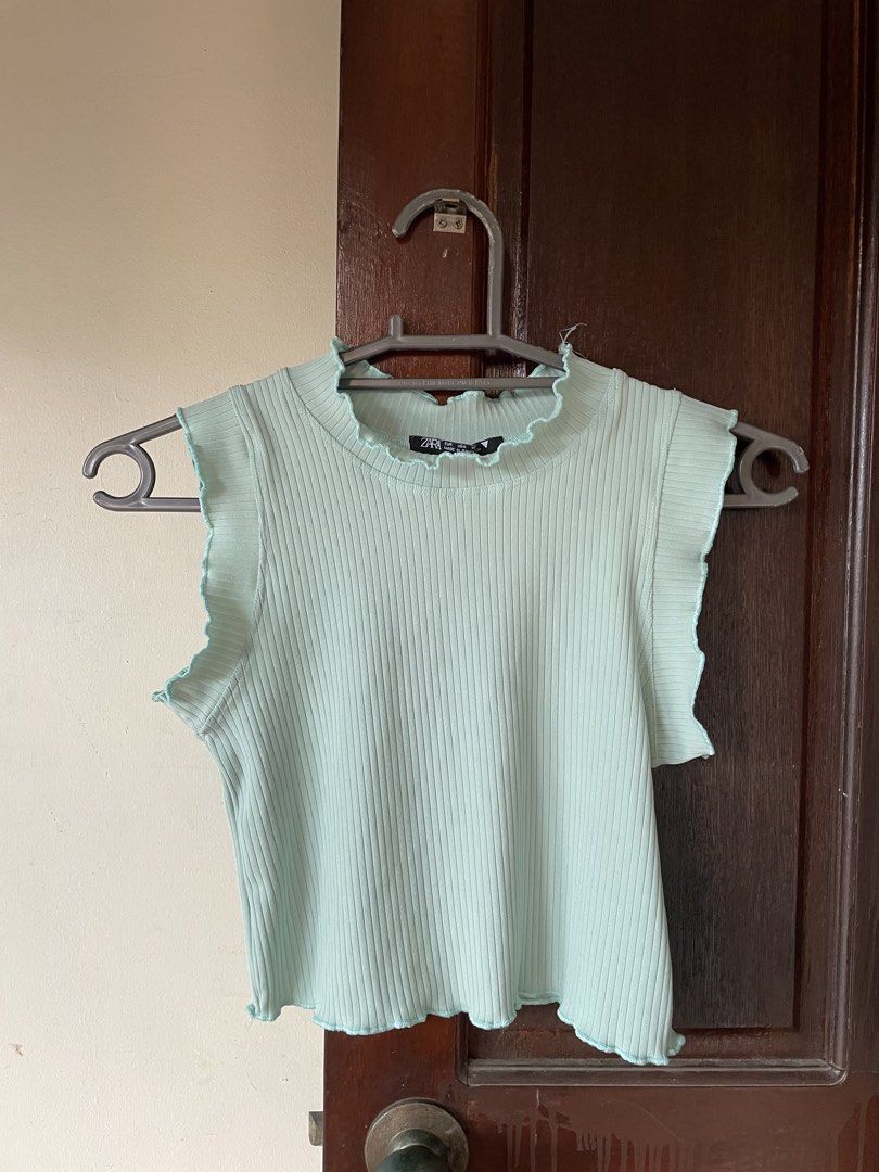 Ribbed Sleeveless Top (Category: Sleeveless) located in Pasig City. Submitted by ysaint (Listing ID 1441794440, Image 1). Description: mint green ribbed top, with mock neck perfect for cute and comfy casual wear fits small :).
