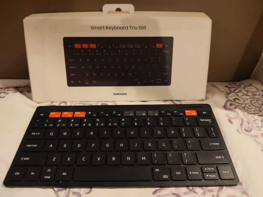 Samsung Smart Keyboard Trio 500 (Category: Computer Keyboard) located in Manila. Submitted by jilliese (Listing ID 1441900857, Image 1). Description: slightly used like new - Samsung Smart Keyboard Trio 500 - Wireless connectivity - Dedicated keys for seamless device switching - Stylish orange accent keys - Compact and portable design - Ideal for multitasking across multiple devices - In excellent working condition.