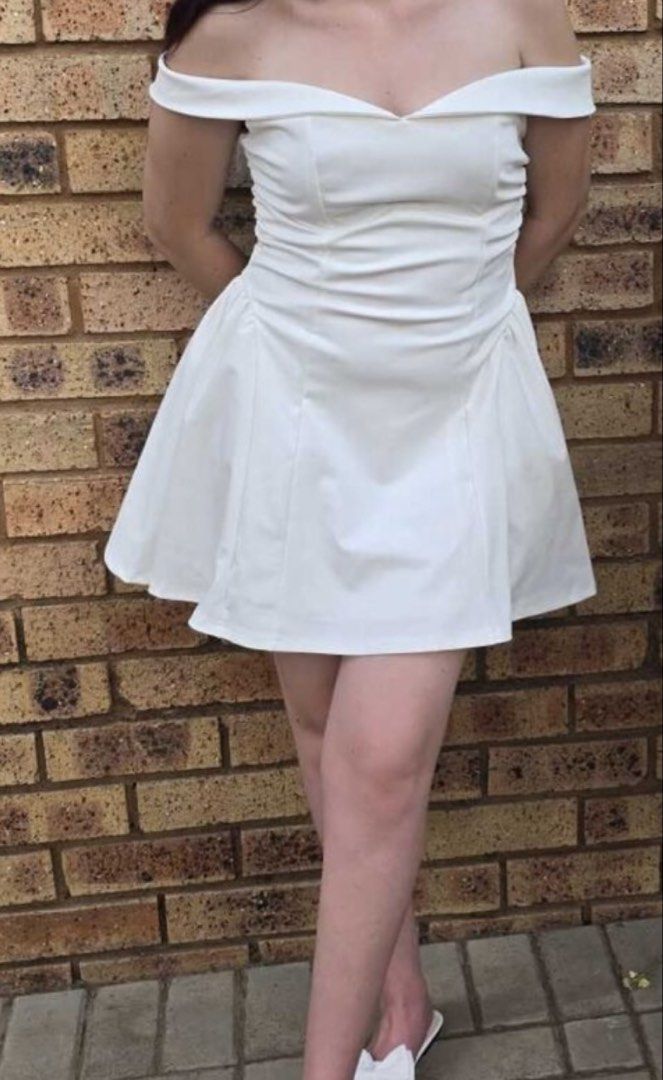 Shein Off Shoulder White Dress (Category: Dresses) located in Manila. Submitted by ae0080 (Listing ID 1441821341, Image 2). Description: - White off-shoulder dress - Sweetheart neckline - Fitted bodice - Flared and pleated skirt - Ideal for parties and events - Flattering fit.