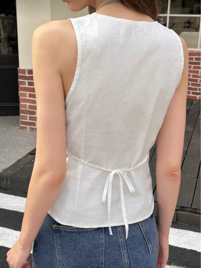 Shein V-Neck White Blouse (Category: Sleeveless) located in Cavite. Submitted by lovedbysham (Listing ID 1441952286, Image 2). Description: - has a small stain on the back - only used once, selling because it does not fit me anymore - perfect for casual wear, picnic date, or summertime .