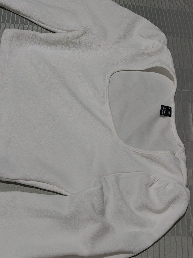 SHEIN White Square Neck Puff Sleeve Crop Top (Category: Blouses) located in Tagaytay City. Submitted by mrskai (Listing ID 1441946486, Image 2). Description: - White crop top from SHEIN - Features a chic square neckline - Trendy puff sleeves with elasticated cuffs - Fabric has a subtle texture - Versatile for casual outings or dressing up RFS: Decluttering.