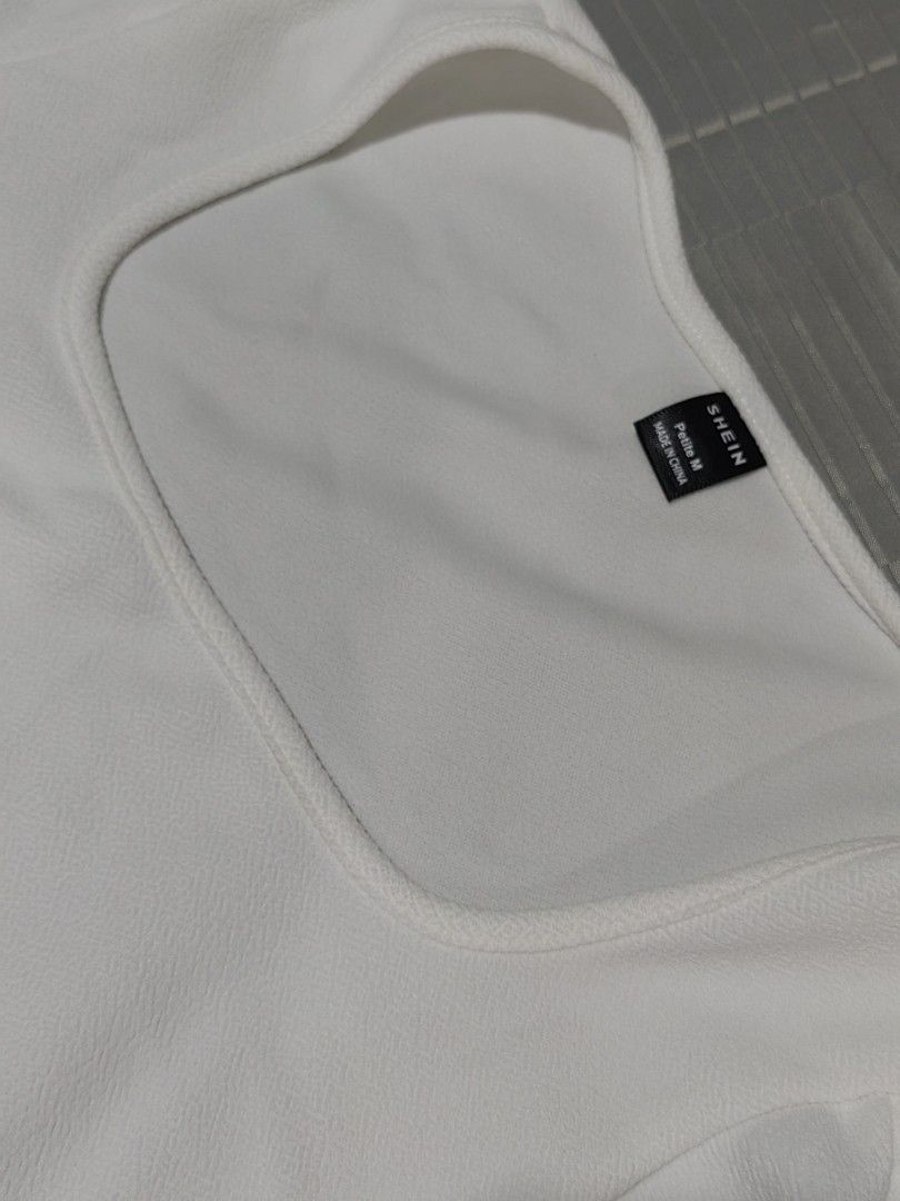 SHEIN White Square Neck Puff Sleeve Crop Top (Category: Blouses) located in Tagaytay City. Submitted by mrskai (Listing ID 1441946486, Image 3). Description: - White crop top from SHEIN - Features a chic square neckline - Trendy puff sleeves with elasticated cuffs - Fabric has a subtle texture - Versatile for casual outings or dressing up RFS: Decluttering.