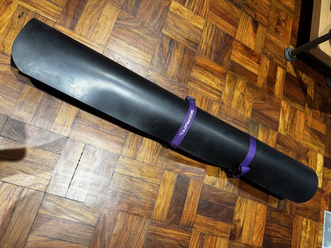 SkippMatt Pro Skipping Rope Mat (Category: Exercise Mats) located in Mandaluyong City. Submitted by j4yw3e (Listing ID 1441903366, Image 2). Description: - Protects your floors from damage and reduce noise while skipping. - Approx. 200cm long and mat is thick and quite heavy. - Suitable for indoor and outdoor use. - Comes with a purple carrying bag and straps. - Visible signs of use such as scuffs from the jump rope. Needs cleaning and conditioni