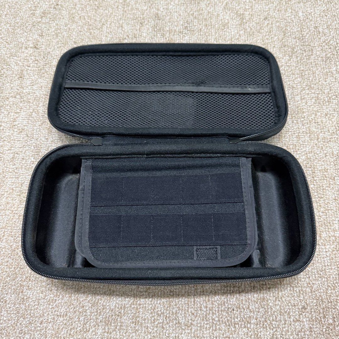 Skull & Co. Nintendo Switch Case (Category: Cases & Covers) located in Bulacan. Submitted by minimalistmermaid (Listing ID 1441902171, Image 3). Description: - Protective hard shell case for Nintendo Switch - Keeps console and games safe during travel - Features slots for game cartridges - Includes a mesh pocket for accessories - Secure zipper closure - Built-in handle for easy carrying.