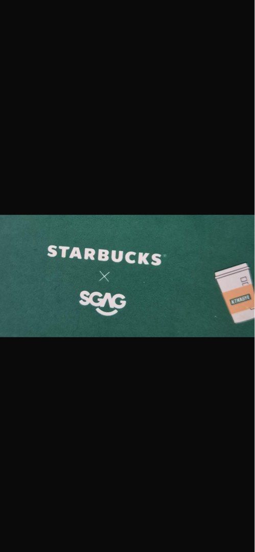 Starbucks x SGAG Notebooks & Smiggle Notebooks (Category: Stationery & School Supplies) located in Singapore. Submitted by carrinevalerie (Listing ID 1441906445, Image 3). Description: - Starbucks x SGAG notebook: Green cover with coffee cup pattern, elastic band with 'KTHXBYE' text. - Two pink Smiggle notebooks: One with cute character faces, another with a superhero design. - Ideal for note-taking or as a thoughtful gift..