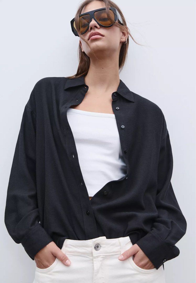Stradivarius Black Oversized Button-Up Shirt Size L (Category: Shirts) located in Mandaluyong City. Submitted by grmnk (Listing ID 1441804199, Image 1). Description: - Stradivarius Black Oversized Shirt - Size: L - Style: Button-up with collar - Sleeves: Long - Versatile: Wear open over a tank or buttoned up - Easy to style for casual or dressed-up occasions I’m usually a size M but I sized up for an even more oversized fit NO FLAWS! BPI / GCash 