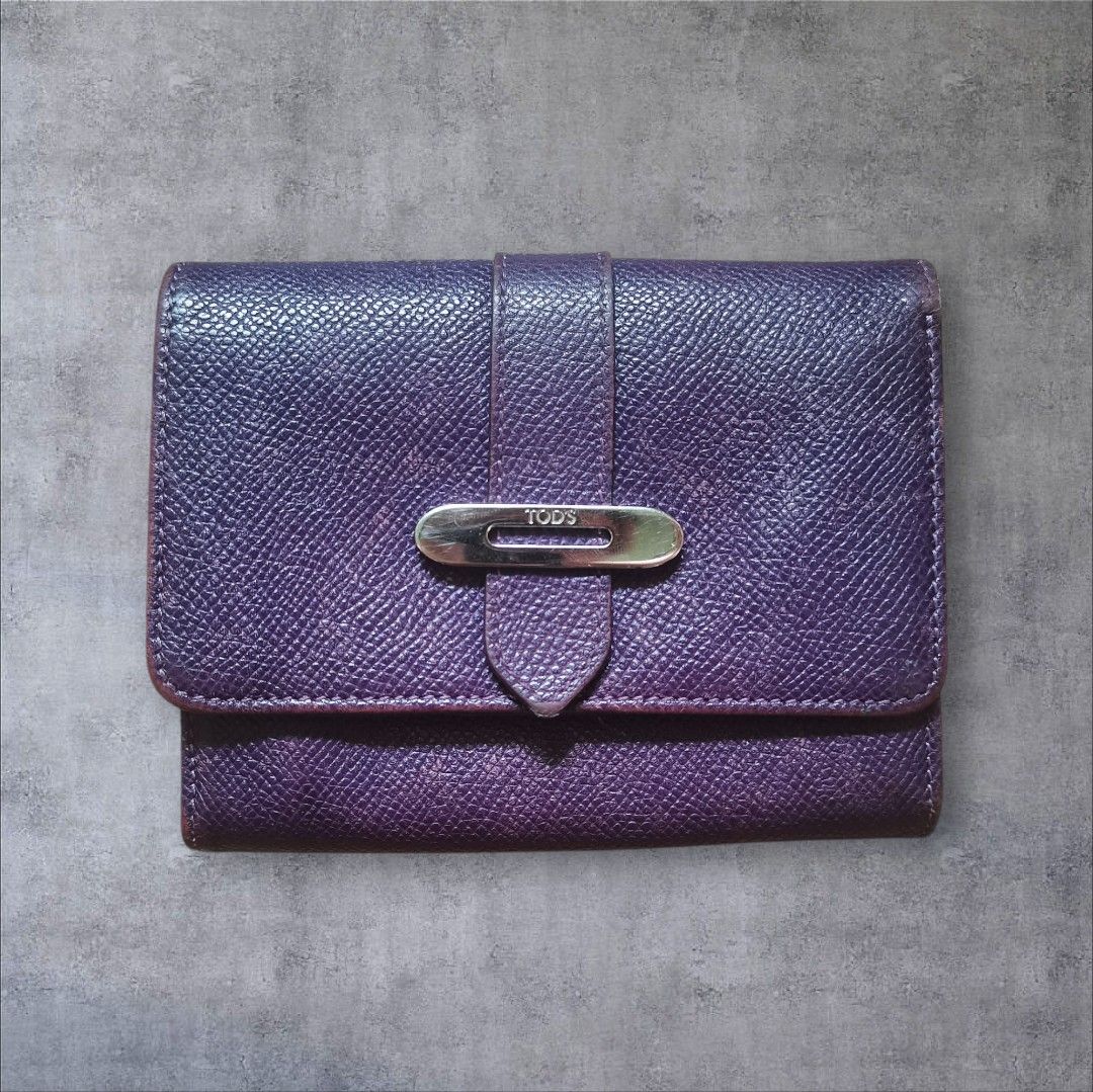 TOD'S Purple Textured Leather Tri-Fold Wallet (Category: Wallets & Card holders) located in Manila. Submitted by eagerbeaverph (Listing ID 1441862886, Image 1). Description: Tods wallet H 4 inches W 5 Signs of usage Rubs scratches creases Please see detailed pics Neg Dm.